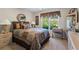 Bedroom showcases a comfortable bed, two side tables with lamps, and a view to the outside at 2191 Flowering Dr, Grayson, GA 30017