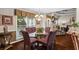 Charming dining room boasts hardwood floors, a chandelier, and backyard views at 2191 Flowering Dr, Grayson, GA 30017