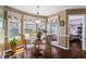 Dining room with hardwood floors, designer lighting and large windows overlooking the backyard at 2191 Flowering Dr, Grayson, GA 30017