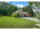 Charming one-story home featuring an attached two-car garage, lush landscaping, and a well-maintained lawn at 2191 Flowering Dr, Grayson, GA 30017