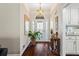 Welcoming foyer features hardwood floors, natural light, and decorative accents at 2191 Flowering Dr, Grayson, GA 30017