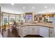 Bright eat-in kitchen with granite counters, white cabinets, hardwood floors and bay window breakfast nook at 2191 Flowering Dr, Grayson, GA 30017