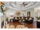 Cozy living room featuring fireplace, hardwood floors, and abundant natural light at 2191 Flowering Dr, Grayson, GA 30017