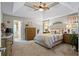 Primary bedroom boasts vaulted ceilings, neutral colors, an ensuite bathroom, and natural light at 2191 Flowering Dr, Grayson, GA 30017