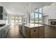 Bright, open kitchen features a large island, modern appliances, and plenty of natural light at 3460 Austin Michael Ln, Cumming, GA 30028