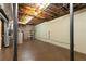 Spacious unfinished basement area offers potential for storage or future living space expansion at 386 Collegiate Dr, Powder Springs, GA 30127