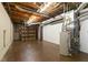 Unfinished basement featuring open ceiling, concrete floor and large space for customization at 386 Collegiate Dr, Powder Springs, GA 30127