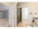 Bathroom featuring a glass door shower, closet, and neutral tile at 386 Collegiate Dr, Powder Springs, GA 30127