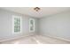 Inviting bedroom with neutral walls, carpet and double windows for natural light at 386 Collegiate Dr, Powder Springs, GA 30127