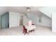 Versatile bonus room with a playful setup, window for natural light, and storage options at 386 Collegiate Dr, Powder Springs, GA 30127