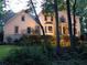 This gorgeous two-story home boasts classic architecture and a well-manicured lawn at 386 Collegiate Dr, Powder Springs, GA 30127