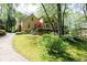 Lovely home with manicured lawn and colorful landscaping offering great curb appeal at 386 Collegiate Dr, Powder Springs, GA 30127