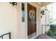 Elegant front door with decorative wreath, sidelight, and traditional hardware at 386 Collegiate Dr, Powder Springs, GA 30127