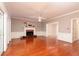 Bright living room with hardwood floors, fireplace, and classic trim details at 386 Collegiate Dr, Powder Springs, GA 30127