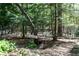Scenic meditation path winds through lush greenery with a sign reading 'Garden Walk' and 'Meditation Path' at 386 Collegiate Dr, Powder Springs, GA 30127