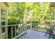 Inviting screened porch with relaxing wooded view at 386 Collegiate Dr, Powder Springs, GA 30127