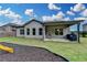 A spacious backyard featuring a covered patio and well-maintained lawn at 3925 Sierra Knolls Ct, Cumming, GA 30040