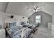 A cozy bedroom with vaulted ceiling features three twin beds and soft neutral decor at 3925 Sierra Knolls Ct, Cumming, GA 30040