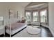 Bright bedroom with an abundance of natural light, complemented by a charming decorative theme at 3925 Sierra Knolls Ct, Cumming, GA 30040