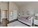 Charming bedroom featuring dark hardwood floors, modern decorations and neutral colored walls at 3925 Sierra Knolls Ct, Cumming, GA 30040
