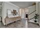 Stylish entryway with decorative console table, hardwood floors, and staircase, creating a welcoming space at 3925 Sierra Knolls Ct, Cumming, GA 30040