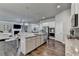 Kitchen with island, stainless appliances and view into living room at 3925 Sierra Knolls Ct, Cumming, GA 30040