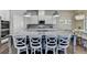 Kitchen island with pendant lights and seating for four at 3925 Sierra Knolls Ct, Cumming, GA 30040