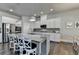 Kitchen with island, stainless appliances, granite counters and bar stool seating at 3925 Sierra Knolls Ct, Cumming, GA 30040