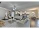 Open concept living room and kitchen with hardwood floors and neutral colors at 3925 Sierra Knolls Ct, Cumming, GA 30040
