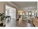 Open-concept living room flows to dining and kitchen, offering abundant natural light at 3925 Sierra Knolls Ct, Cumming, GA 30040
