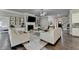 Open concept living room features a fireplace, hardwood flooring and neutral colors at 3925 Sierra Knolls Ct, Cumming, GA 30040