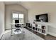 A bright home office featuring a large window, sleek furniture, and modern decor at 3925 Sierra Knolls Ct, Cumming, GA 30040
