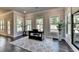 Sitting room features hardwood floors and lots of windows with natural light at 3925 Sierra Knolls Ct, Cumming, GA 30040