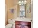 Bathroom featuring a vanity with updated fixtures, a toilet and a shower with a curtain at 105 New Castle Ln, Tyrone, GA 30290