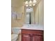 Bathroom featuring wood vanity, white countertop, silver faucet, and tiled walls at 105 New Castle Ln, Tyrone, GA 30290