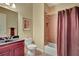 Bathroom with tile flooring, shower and tub combo, vanity and toilet at 105 New Castle Ln, Tyrone, GA 30290