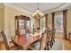 Elegant dining room with hardwood floors, a grand table and chandelier at 105 New Castle Ln, Tyrone, GA 30290