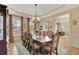 Formal dining room with a large dining table and a chandelier at 105 New Castle Ln, Tyrone, GA 30290