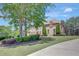 Beautiful two-story brick home with manicured lawn and professional landscaping at 105 New Castle Ln, Tyrone, GA 30290