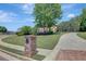 Well-maintained landscape with long driveway leading to a luxurious brick home at 105 New Castle Ln, Tyrone, GA 30290