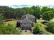 Stately home featuring a patio, well-manicured lawn, and mature trees at 105 New Castle Ln, Tyrone, GA 30290