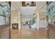 Inviting foyer with gleaming hardwood floors, soaring ceilings, and views into the living spaces at 105 New Castle Ln, Tyrone, GA 30290