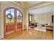 Welcoming foyer with hardwood floors, arched doorway, and stylish decor at 105 New Castle Ln, Tyrone, GA 30290