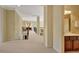 Inviting hallway features an open staircase and a view of the bathroom and upper-level living spaces at 105 New Castle Ln, Tyrone, GA 30290