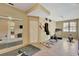Bright home gym with mirrored wall, exercise equipment, and large windows at 105 New Castle Ln, Tyrone, GA 30290