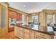 Modern kitchen with stainless steel appliances, custom cabinets, and an adjacent eating area at 105 New Castle Ln, Tyrone, GA 30290