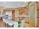 Spacious kitchen island featuring granite countertops, seating, and stainless-steel appliances at 105 New Castle Ln, Tyrone, GA 30290