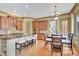 Gourmet kitchen with a large island, stainless steel appliances, and an adjacent dining area at 105 New Castle Ln, Tyrone, GA 30290