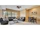 Living room featuring plush seating, ceiling fan, dining area, and large windows at 105 New Castle Ln, Tyrone, GA 30290