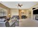 Inviting living room with a fireplace, comfortable seating, and a view of the outdoors at 105 New Castle Ln, Tyrone, GA 30290